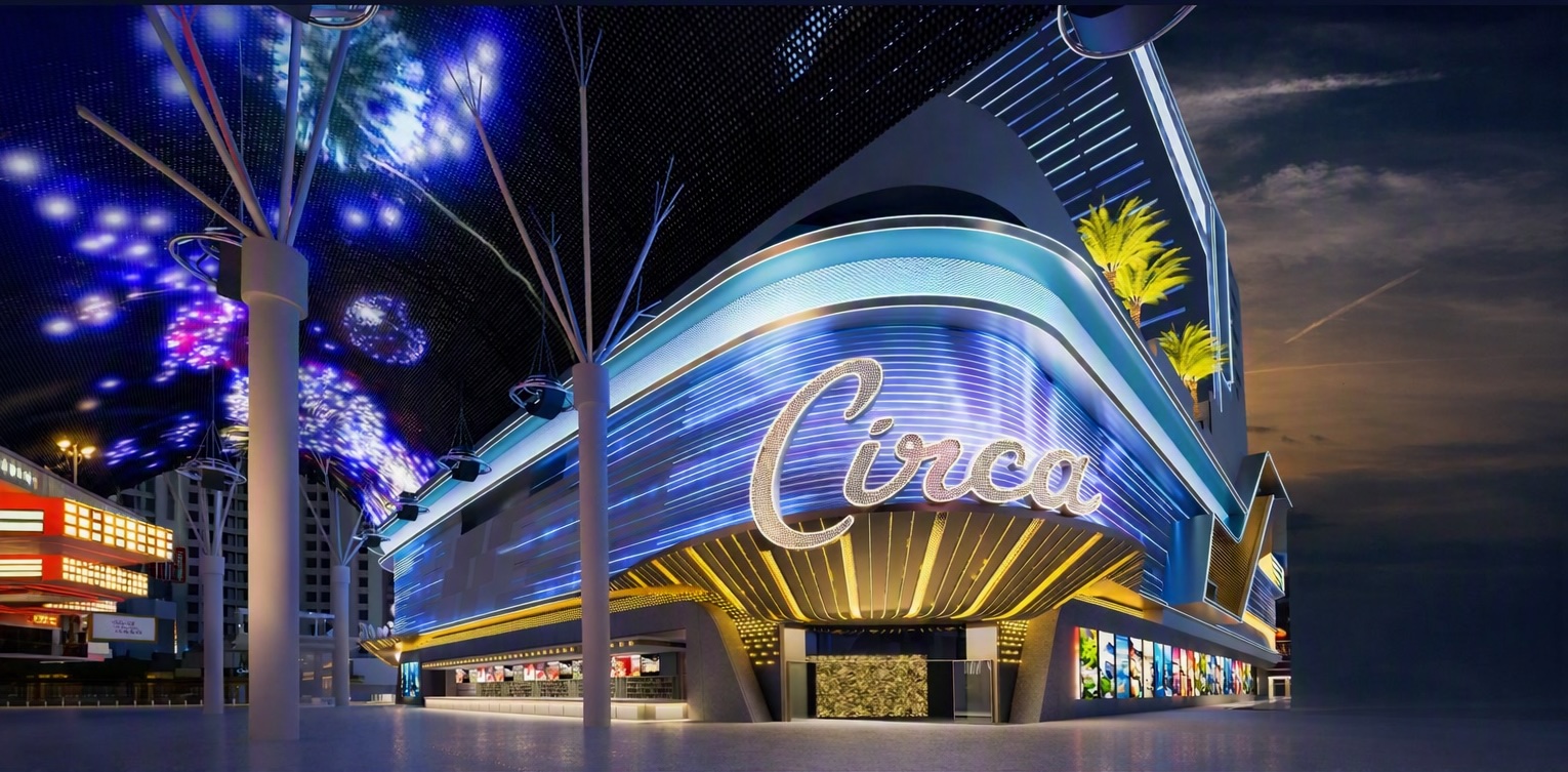 Exterior of Circa casino in Las Vegas at twilight, with blue neon lights and a dark sky